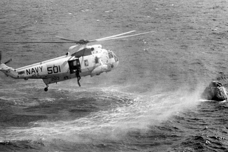 SH-3A dropping rescue swimmer during astronaut recovery