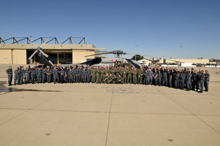 HS-6 Squadron members with SH-60F in background